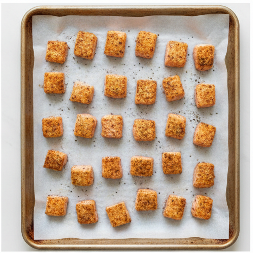 bang bang salmon - salmon cubes on baking sheet ready for oven