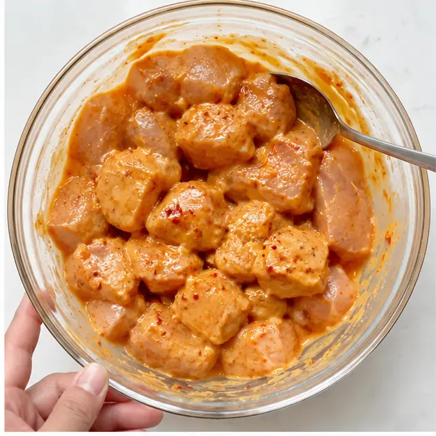 Step 2: Tossing chicken chunks in the marinade