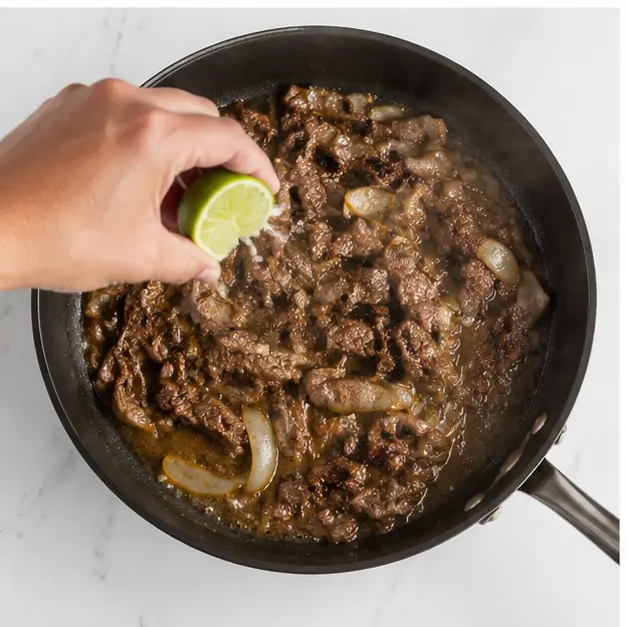 Step 3: Adding lime juice and finishing the cooking
