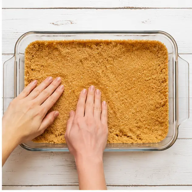Step 2: Pressing crust into baking dish