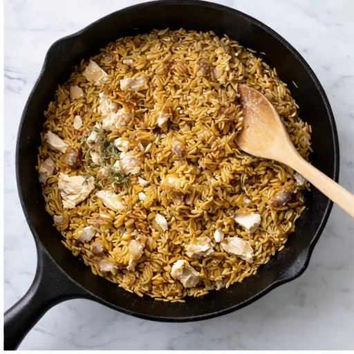 Step 2: Toasting orzo pasta with caramelized onions and shredded chicken