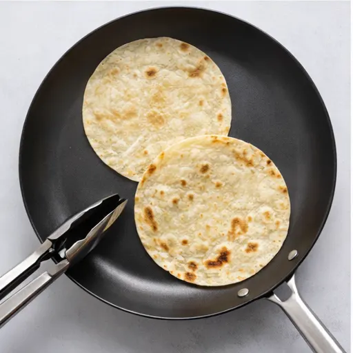 Step 3: Warm corn tortillas in dry skillet