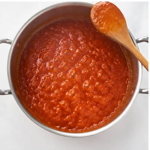 Step 3: Simmering the sauce with spices until it thickens beautifully