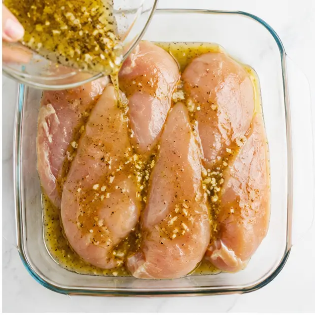 Step 2: Pouring marinade over chicken fillets