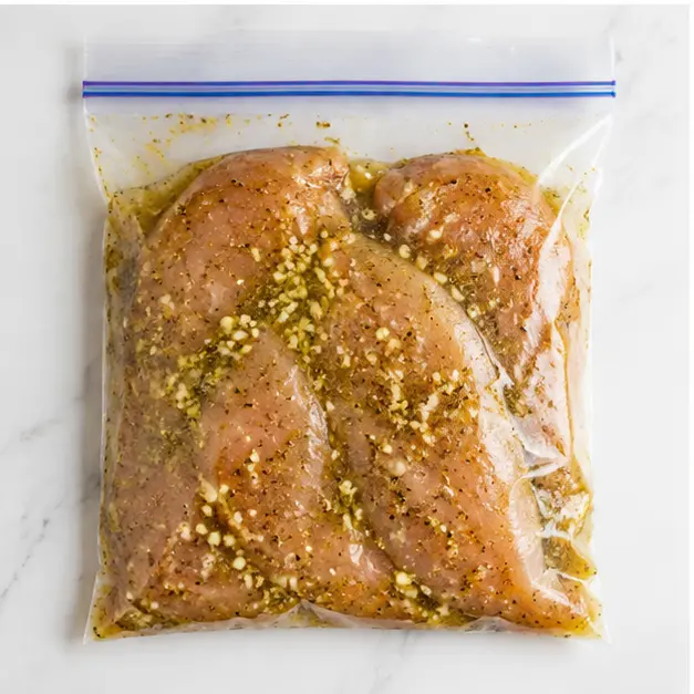 Step 3: Sealing chicken in a zip-top bag with marinade