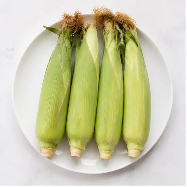 Step 1: Placing corn on a microwave-safe plate