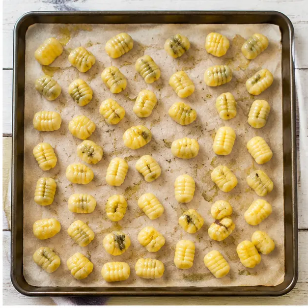 Step 2: Spreading gnocchi on a baking sheet