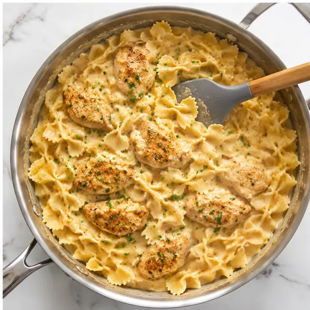 Step 4: Combining pasta, chicken, and sauce with Parmesan