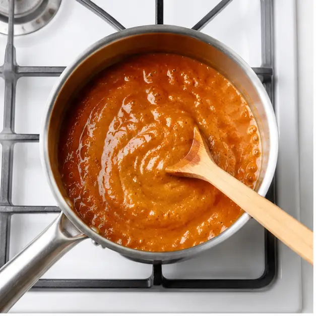 Step 1: Simmer pumpkin sauce on stove