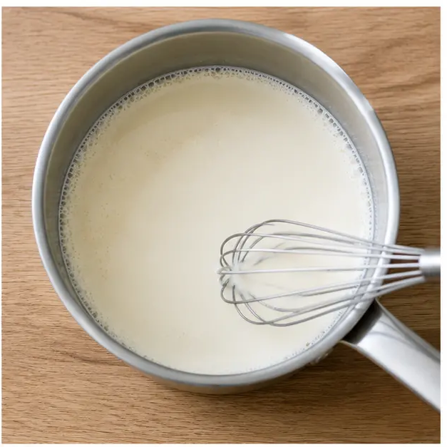 Step 2: Heating cream and milk with sugar