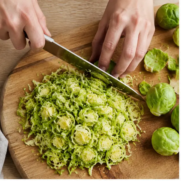 Shave whole brussels sprouts into thin ribbons with a chef's knife or food processor