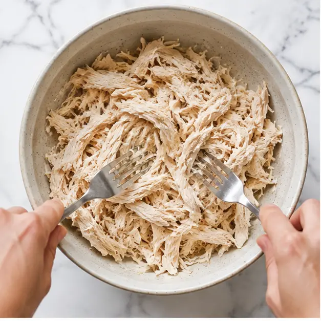 Step 1: Shredding the cooked chicken