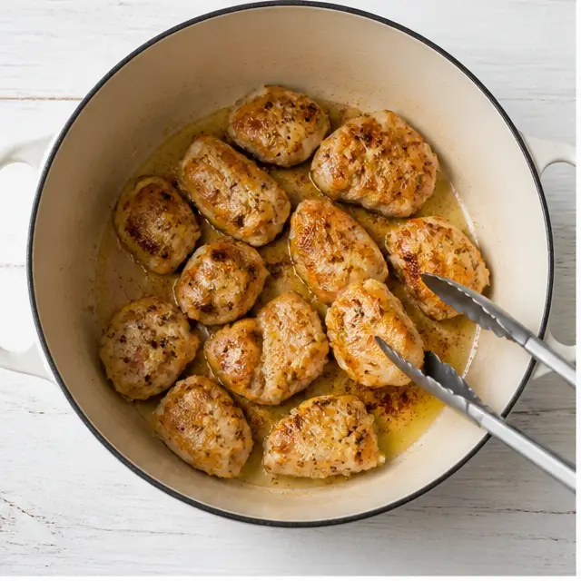 Sear the seasoned chicken until golden on all sides