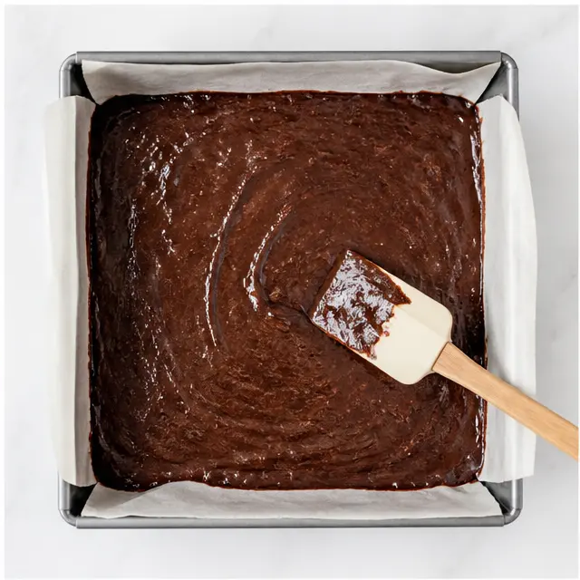 Step 4: Smoothing batter into a lined 9x9 pan