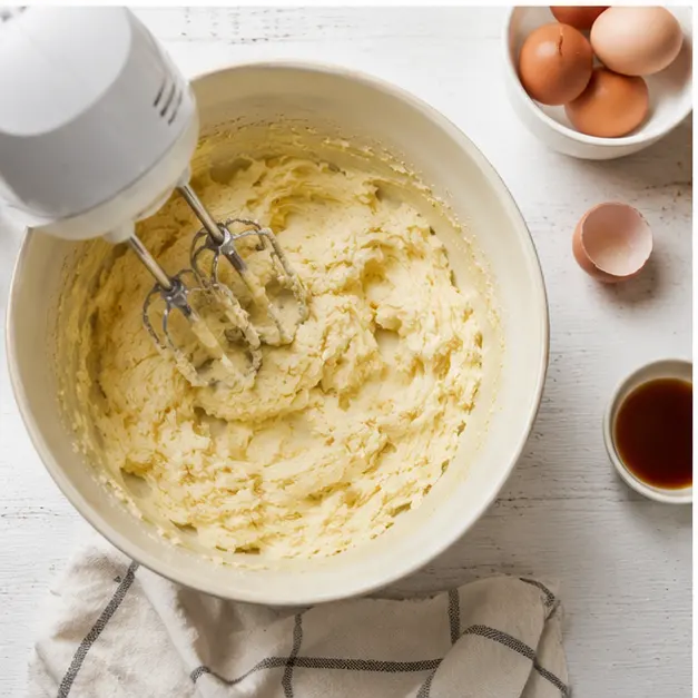 Cream softened butter and granulated sugar with an electric mixer until light and fluffy, then fold the sour cream batter together