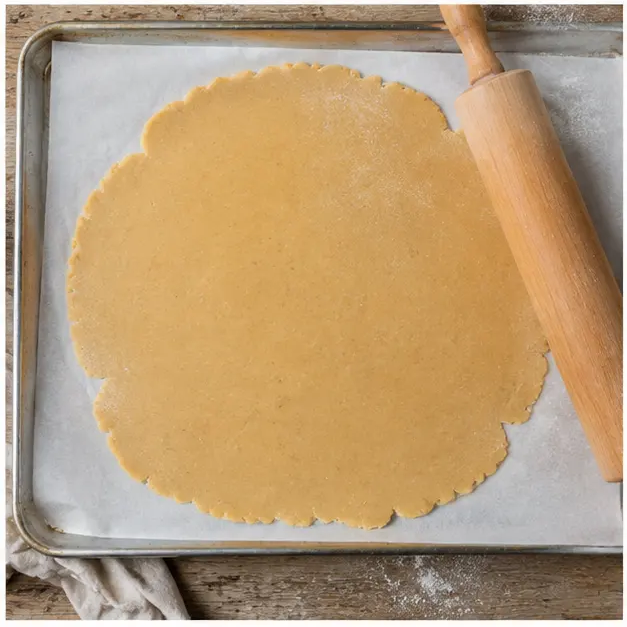 Step 3: Rolling the dough on parchment paper for chilling